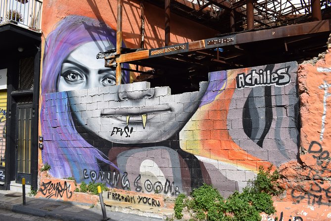 Athens street art tour - Metaxourgio: social initiative murals and the owl of Athens