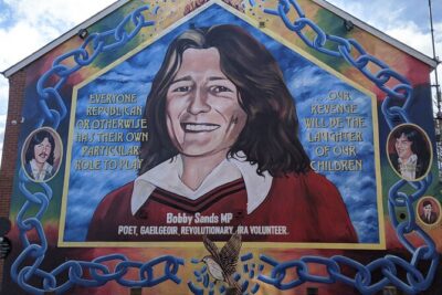 Belfast Troubles Murals Street Art and Peace Wall Walking Tour - Stop 1: Cathedral Quarter murals, re-imaging, and the turn toward Peace
