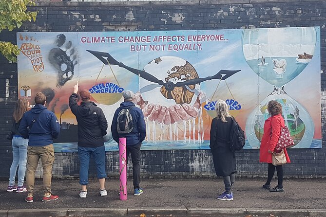 Belfast Troubles Murals Street Art and Peace Wall Walking Tour - Stop 3: Divis Street’s International Mural Wall and the global causes thread