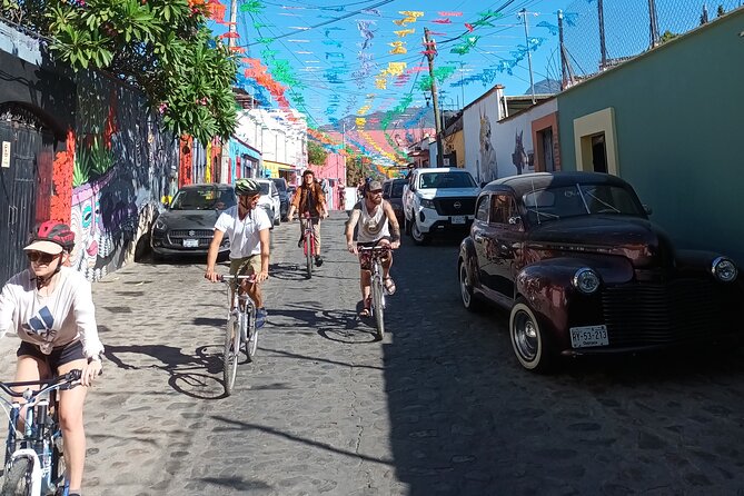 Bicycle Tour through Oaxaca learning about its Urban Art and History - Los Arquitos de Xochimilco: old aqueduct arches under street-level life