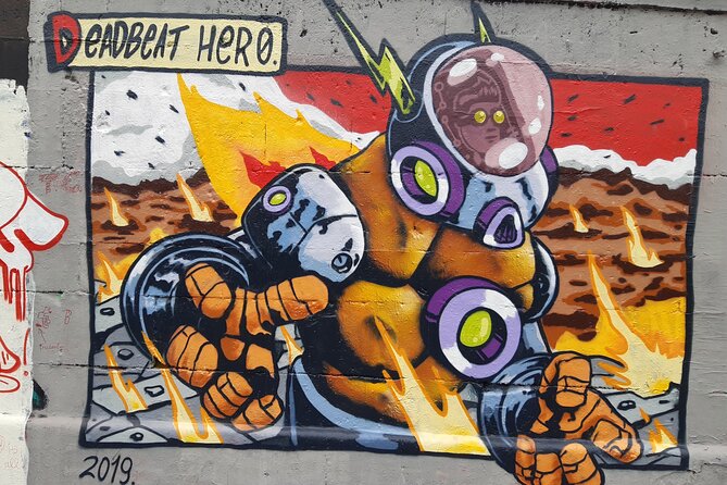 Street Art Tour in Vienna - Friedensbrücke: Overpainted Walls, TS90, and an Octopus by Manuel Muriel