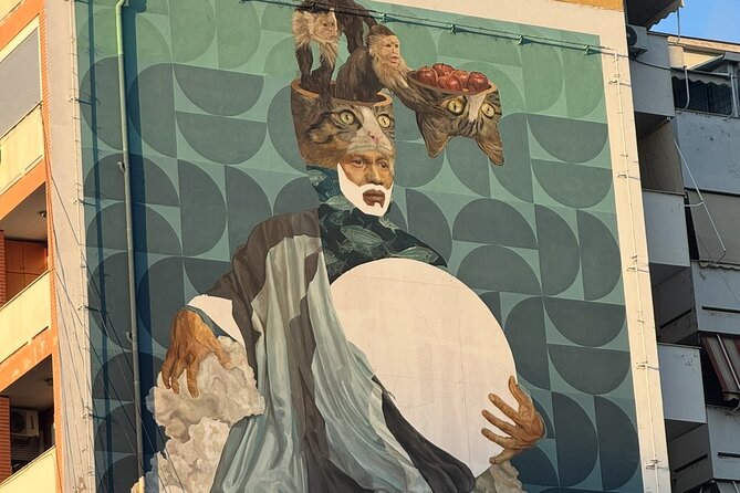 Tirana Mural Bike Tour: Street Art, Culture & Photography Stops - Reja The Cloud: photography meets public space design